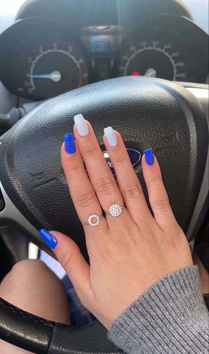 Bold Blue and White Nail Design: A Trendy Everyday Look with Elegant Accessories.