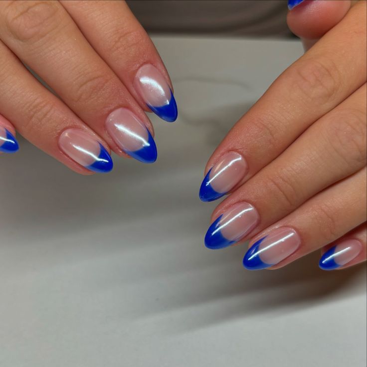 Modern Elegant Nail Design: Transparent Base with Vibrant Blue Tips