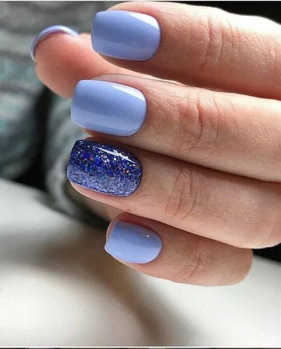 Chic Pastel Lavender Nails Accentuated with Sparkling Blue Glitter Accent