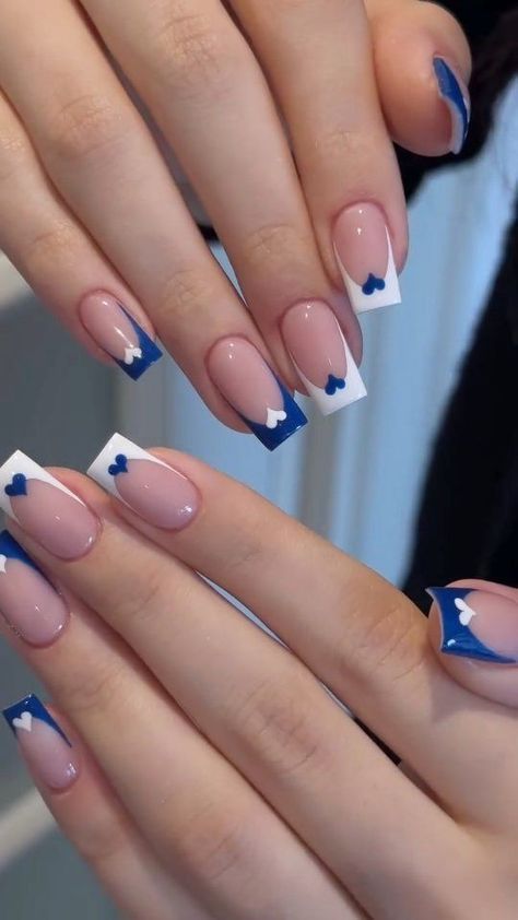 Chic Nail Art Blending Soft Pink, White, and Deep Blue with Playful Heart Accents.