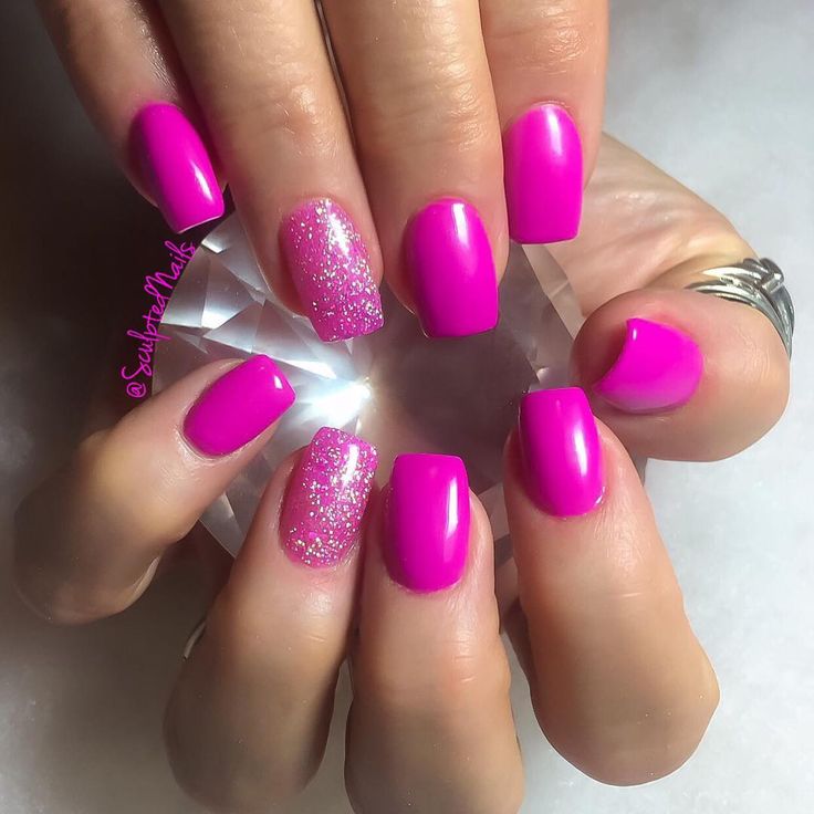 Bold Vibrant Pink Nail Design with Glossy Finish and Sparkling Silver Glitter Accent.