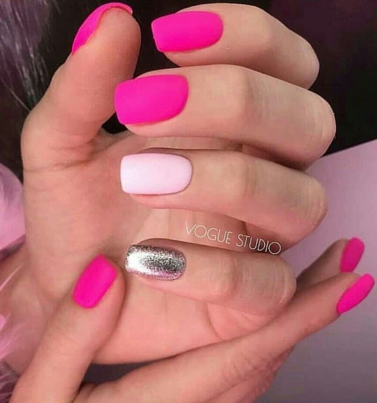 Bold Pink Nails with Elegant White Accent and Glamorous Silver Glitter for a Creative Modern Look.