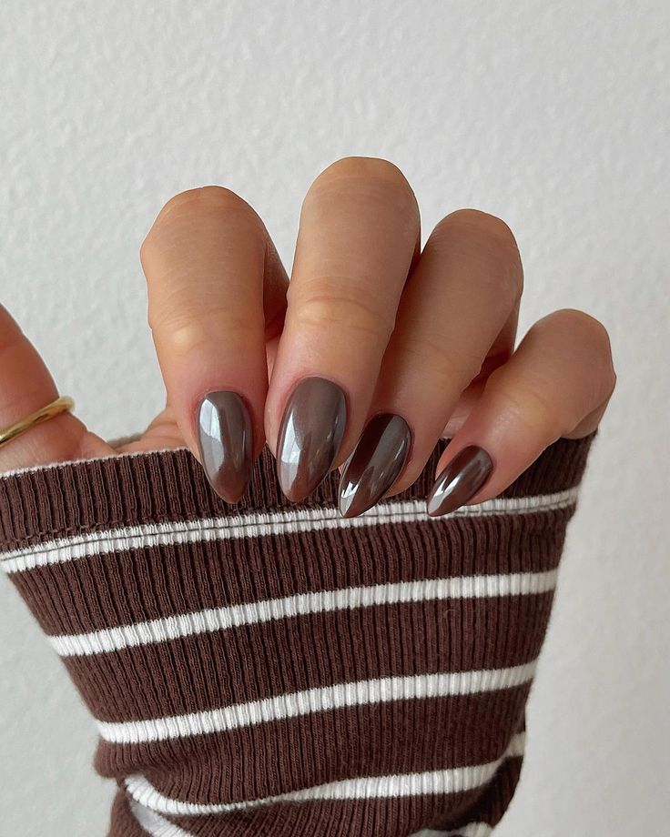 Chic Chocolate Brown Almond Nails with Glossy Finish and Reflective Accents