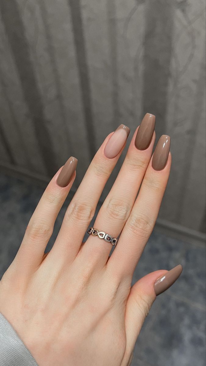 Elegant Almond-Shaped Manicure with Matte and Glossy Finish, Accented by a Delicate Silver Ring.