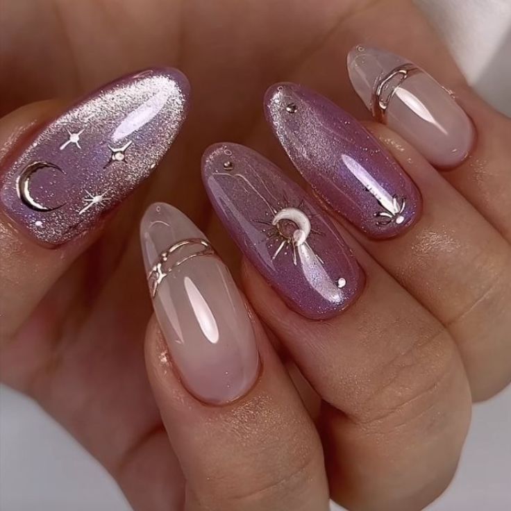 Whimsical Lavender and Pink Nail Design with Celestial Motifs and Elegant Accents.