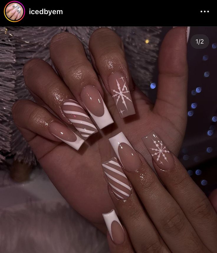 Festive Holiday Nail Design: Elegant Nude and White with Candy Cane and Snowflake Patterns on Square Nails.