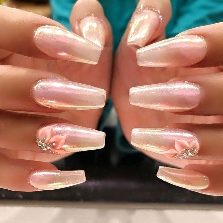 Elegant Iridescent Long Nails with Floral Gem Accents for Feminine Sophistication.