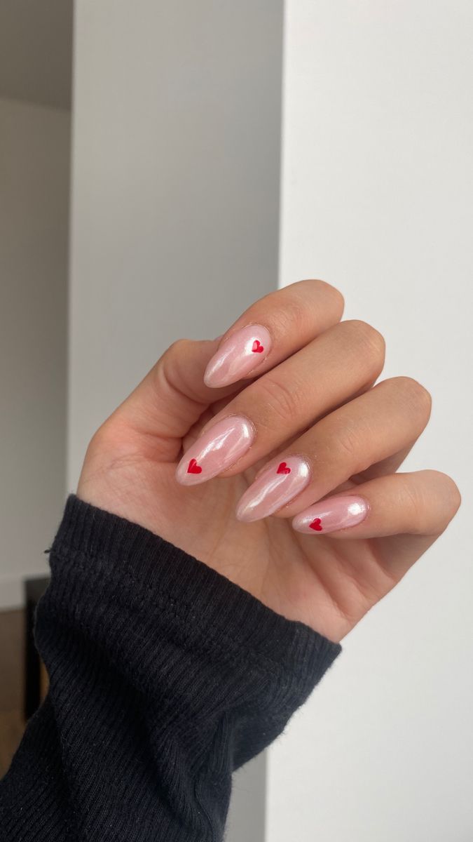 Playful Pink Nails with Glossy Finish and Charming Red Heart Accents for a Romantic Touch.