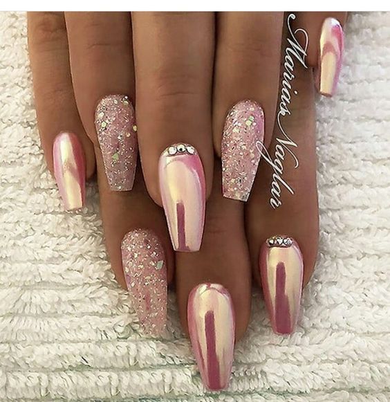 Elegant Nail Design: Soft Pink and Shimmering White with Glitter Accents and Rhinestone Glamour for Special Occasions.