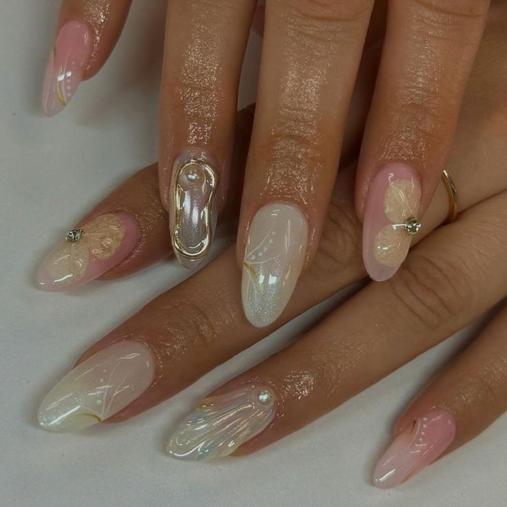 Sophisticated Soft Pink and Iridescent Nail Design with Delicate Embellishments.