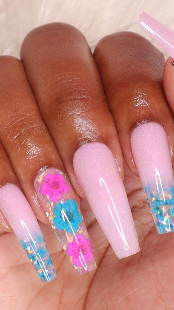 Chic Floral Nail Design: Soft Pink Base with Vibrant Flower Accents