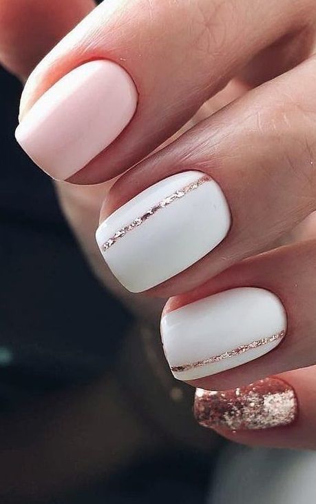 Elegant Pastel Pink and White Nail Design with Rose Gold Accents and a Glittery Statement Nail