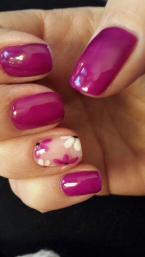 Bold Magenta Nail Design with Delicate Floral Accent for a Chic Look.