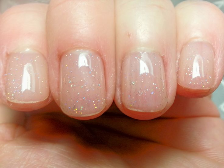 Elegant Nude Nail Design with Subtle Glitter Accents