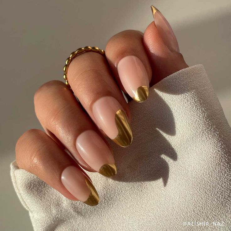 Chic Gold-Tipped Nude Nails: A Perfect Blend of Modern Elegance and Understated Glamour.