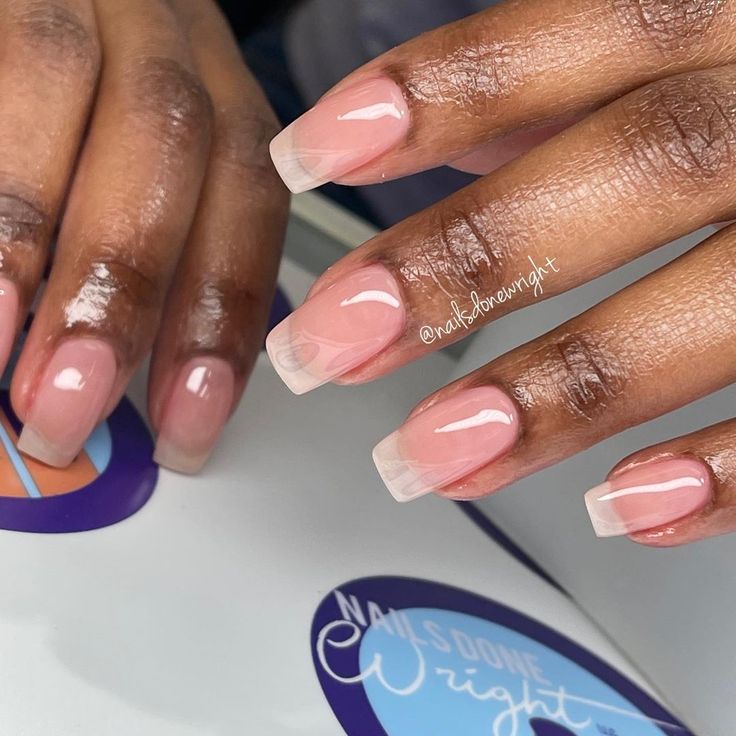 Sophisticated French Tip Acrylic Nails with Subtle Pink Ombre.