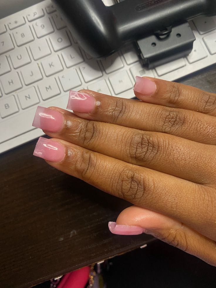 Chic Soft Pink and Clear Tip Nail Design with Modern Gradient.