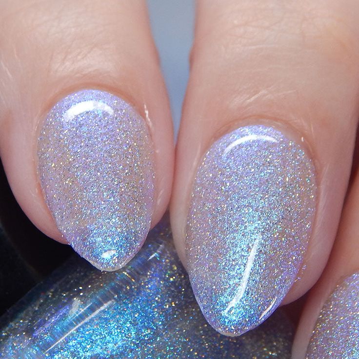 Mesmerizing Iridescent Nail Design with Holographic Glitter and Shimmering Elegance.