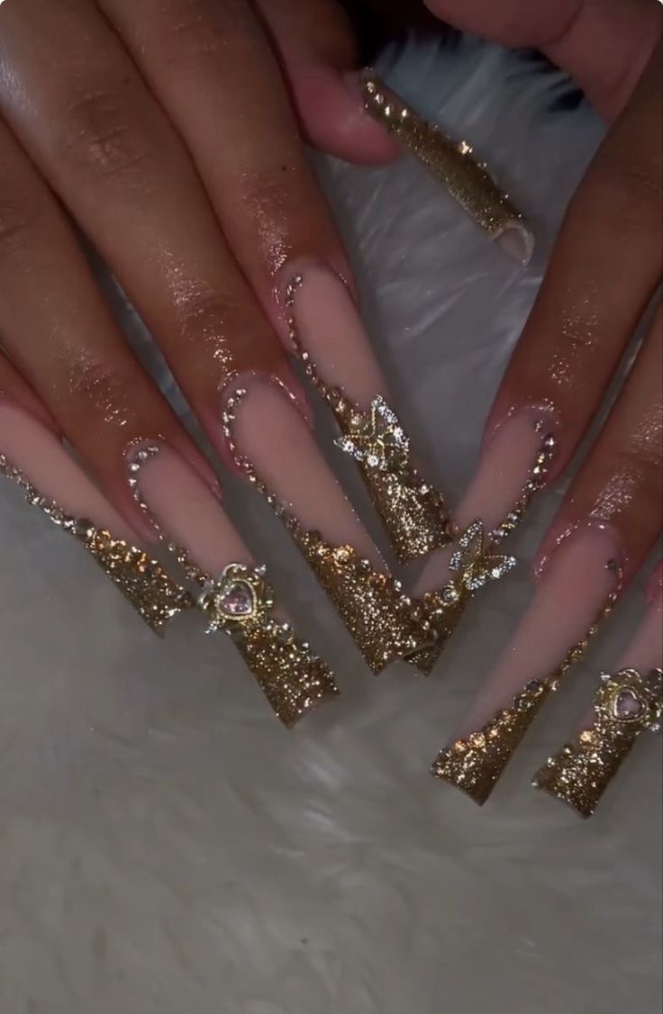 Opulent Golden Gradient Nail Design with Rhinestones and Elegance.