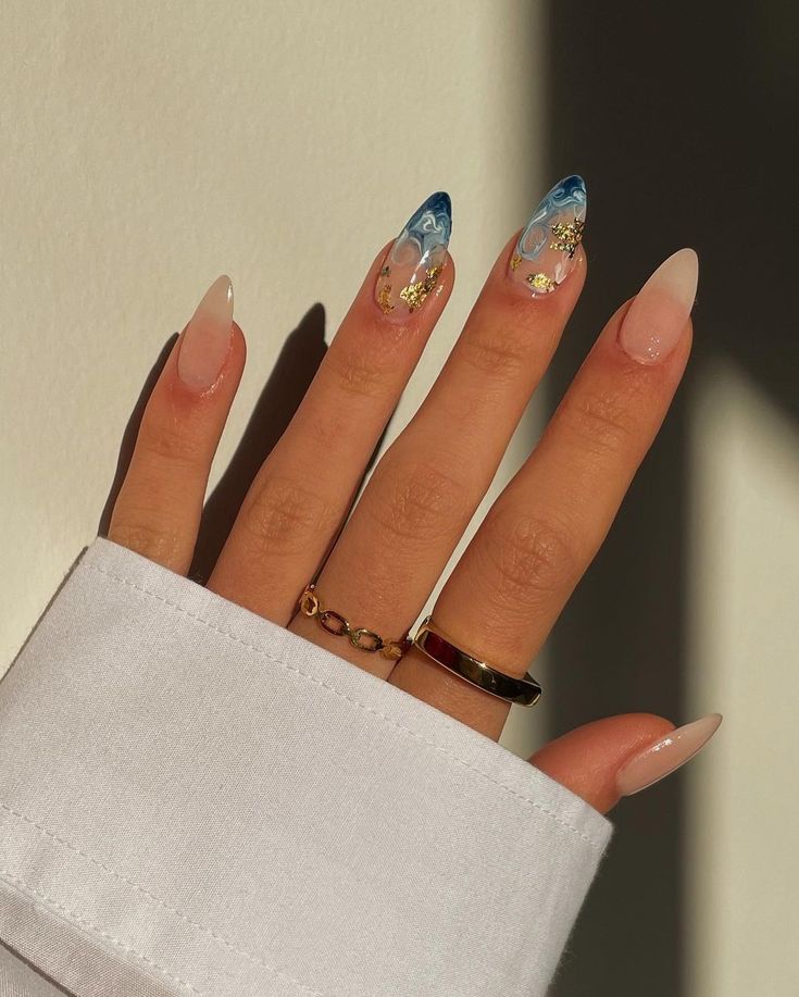 Elegant Almond-Shaped Nail Design with Gradient Blue Tips and Gold Accents.