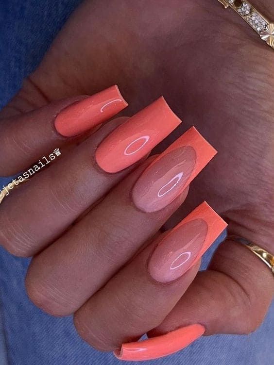 Vibrant Coral Ombre Nail Design: A Perfect Blend of Elegance and Playfulness