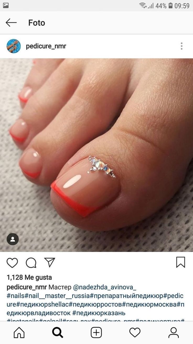 Chic Coral-Tipped Nude Pedicure with Elegant Silver Accents.