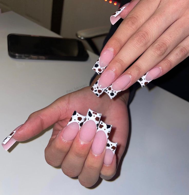 Chic Cow-Print Nails with Pink and White Tips: A Playful Statement in Nail Art.