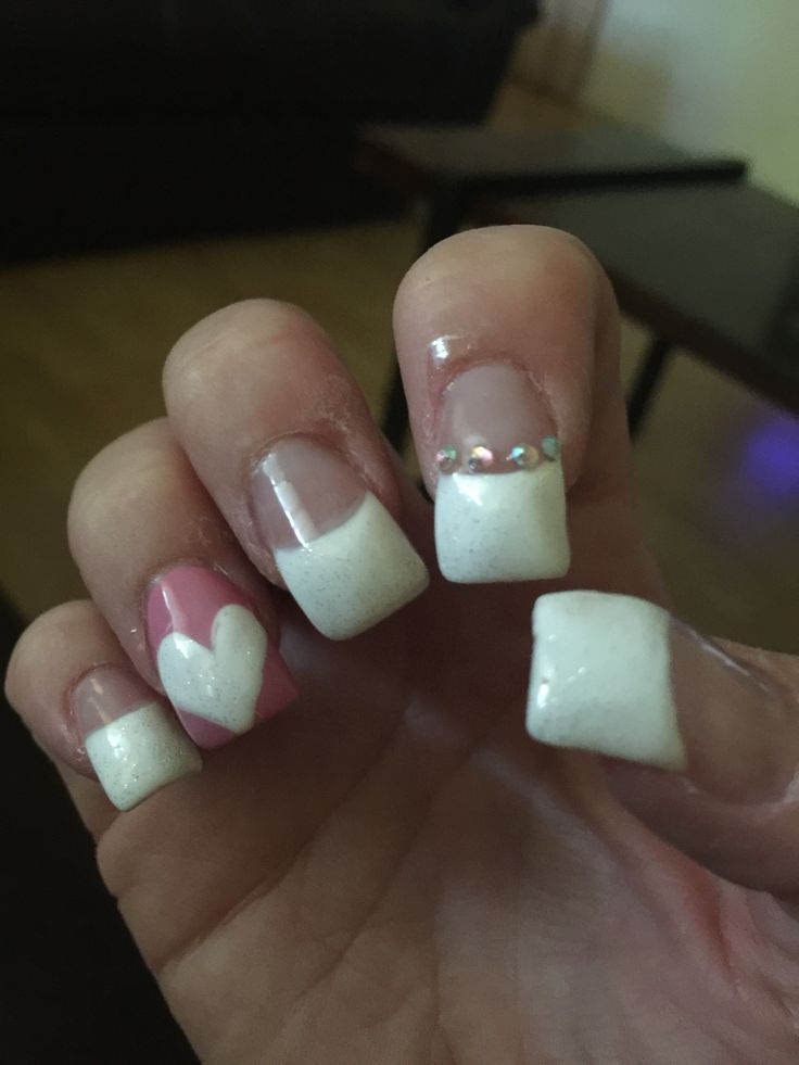 Elegant Nail Design with Classic White Tips and Playful Accents