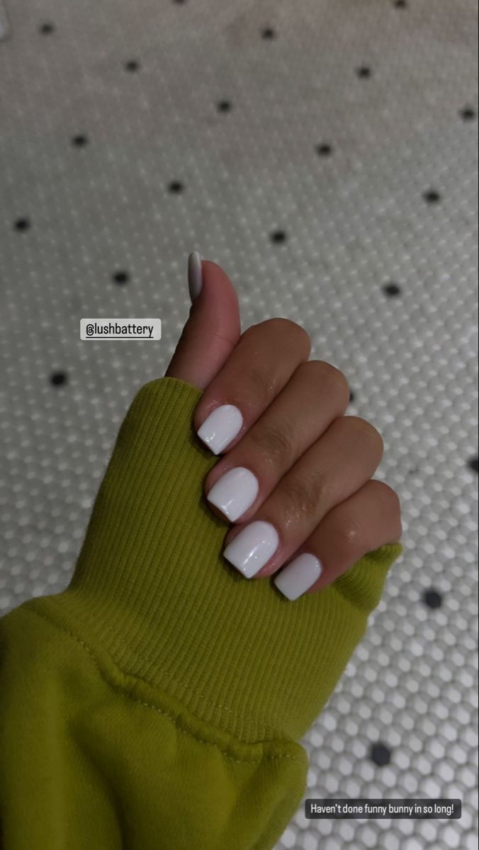 Chic & Cozy: Classic Glossy White Nails Paired with an Oversized Green Sweater.