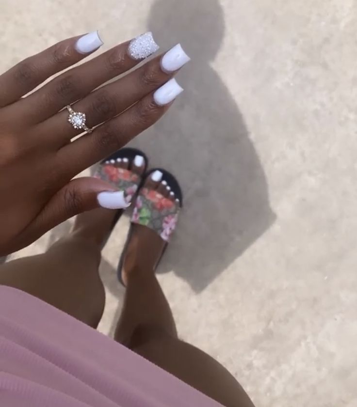 Chic White Nail Design with Sparkling Accents for a Relaxed Summer Look