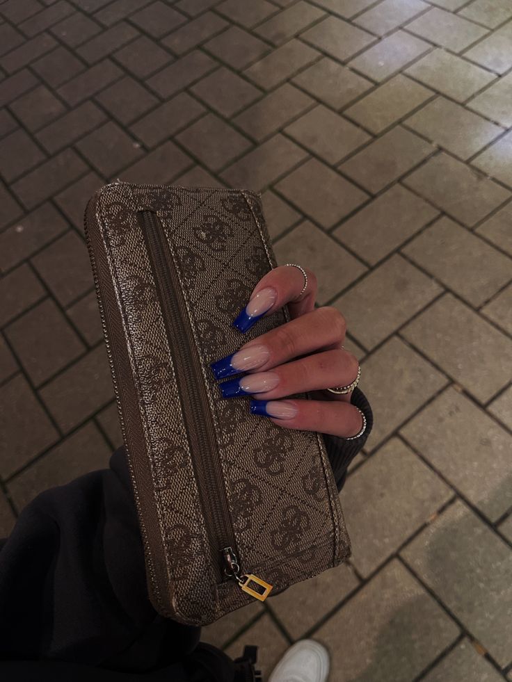 Stunning Gradient Acrylic Nails in Royal Blue Complement Chic Accessories.