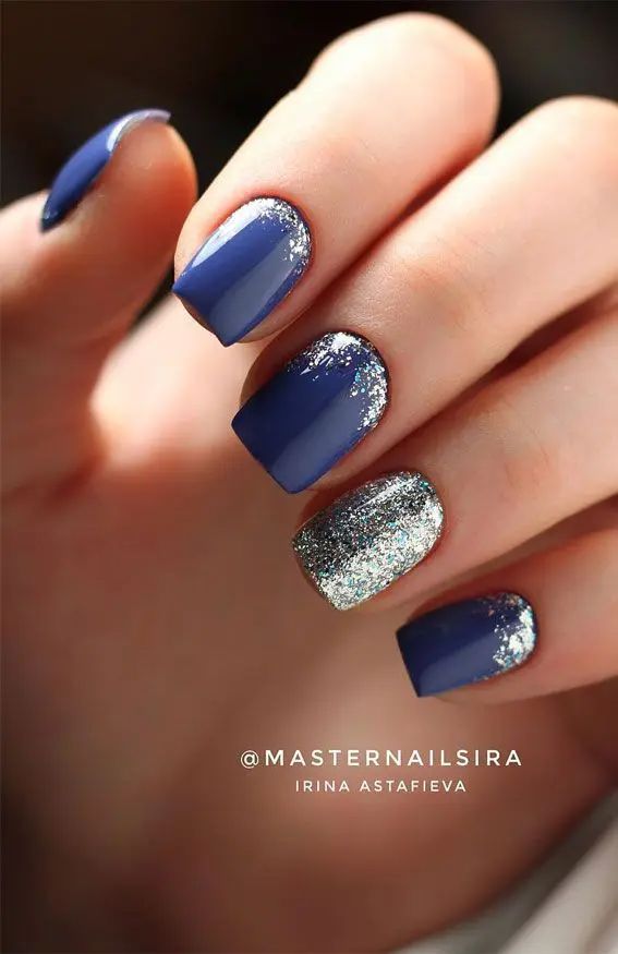 Sophisticated Deep Blue and Shimmering Silver Nail Design: A Bold Glam Statement.