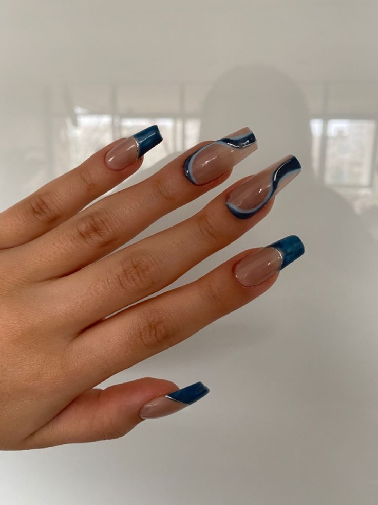 Chic Nude and Dark Blue Nail Design with Wavy Patterns for a Trendy Look.