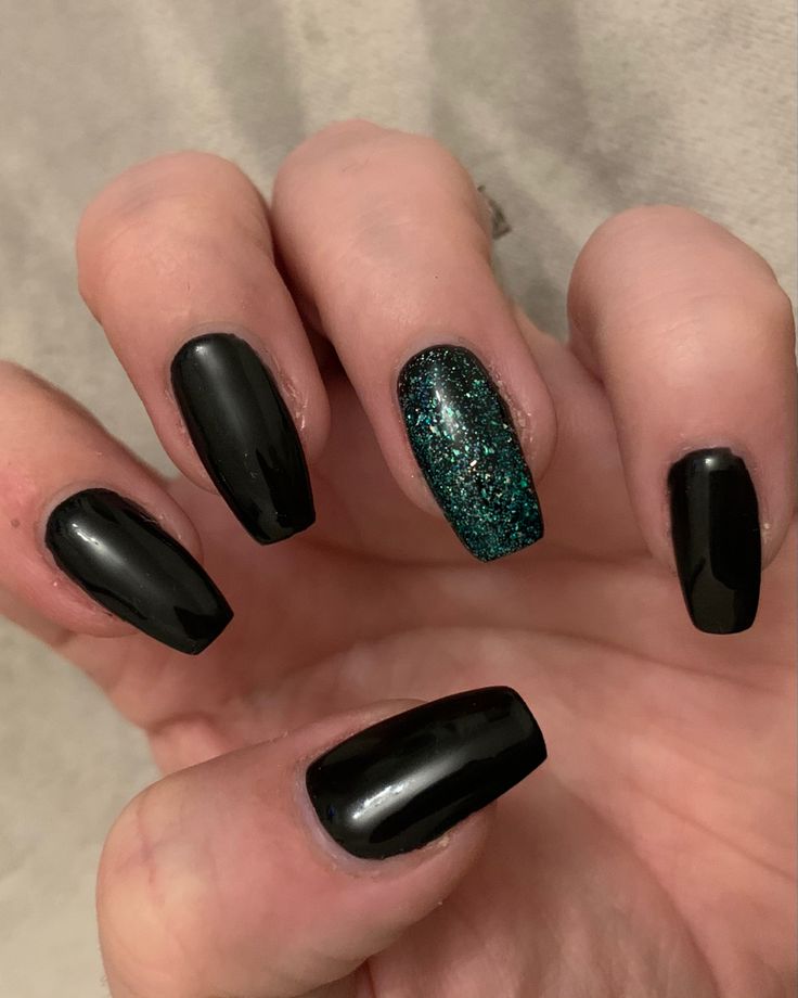 Striking Contrast: Glossy Black Nails with Glitter Accent for Bold Statements.