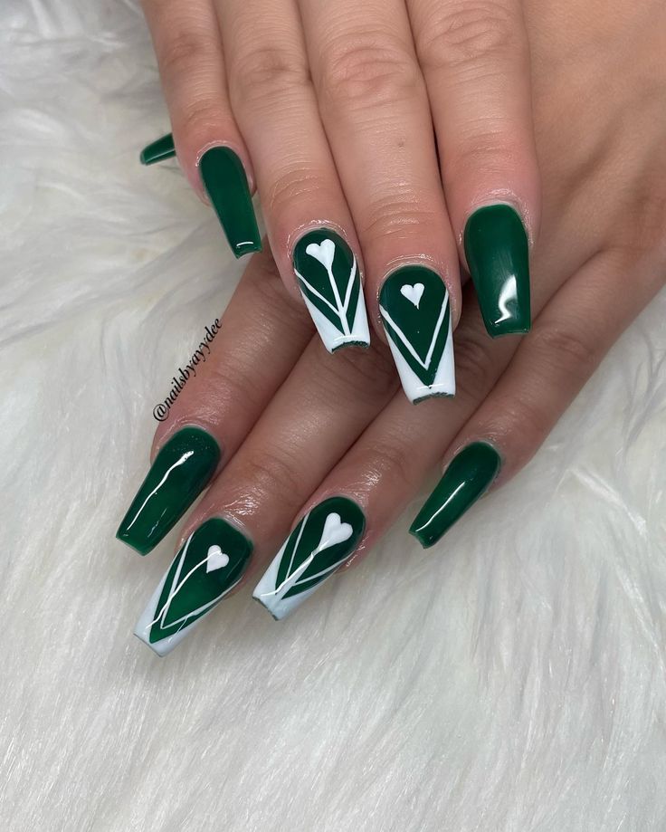 Chic Dark Green and White Nail Design with Heart and Geometric Patterns.