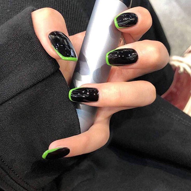 Bold Black Nails with Neon Green Tips: A Versatile Statement Manicure