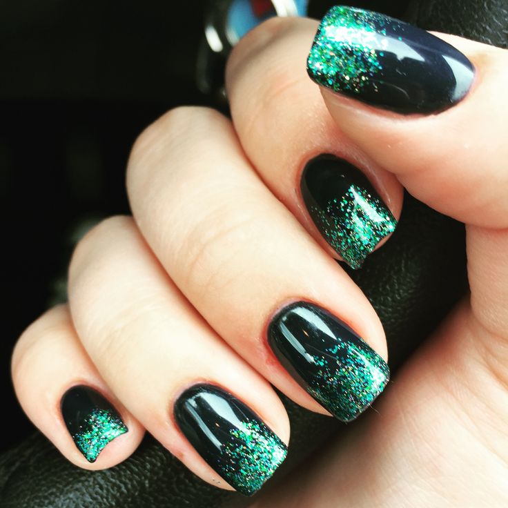 Stunning Gradient Nail Design: Deep Black Base with Vibrant Green Glitter Tips