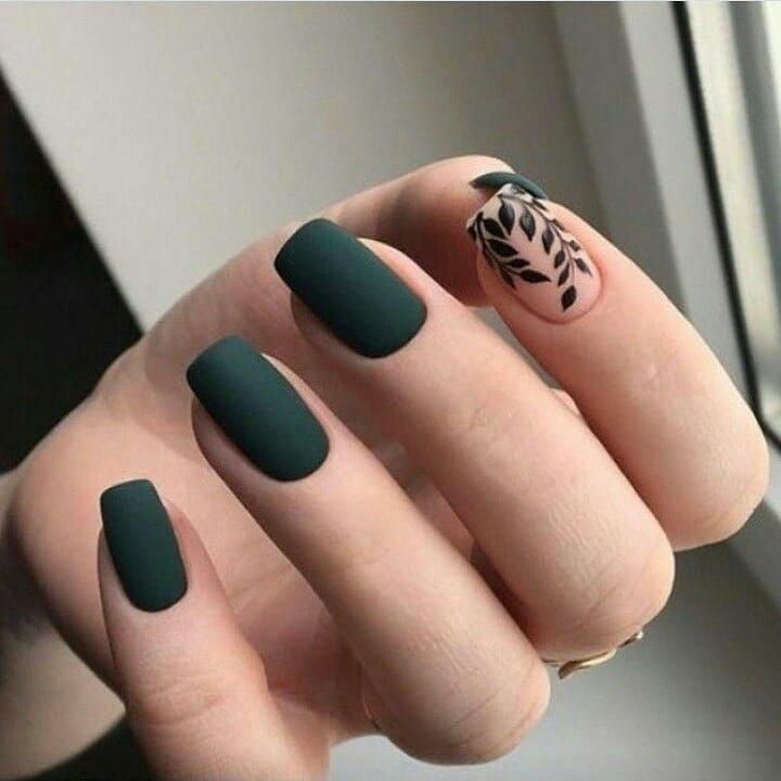 Stylish Matte Green Nails with Subtle Botanical Design Offer a Modern Yet Natural Aesthetic.