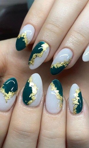 Sophisticated Nail Art: Deep Green and Soft Nude with Gold Foil Accents.