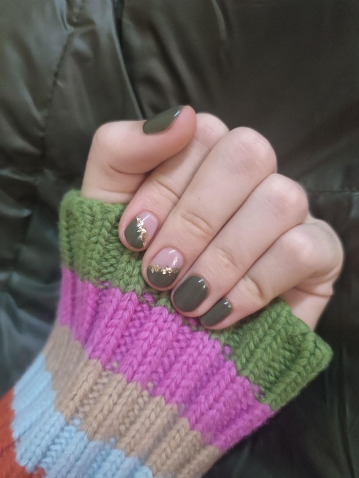 Chic Nail Design: Deep Green and Nude with Elegant Gold Accents