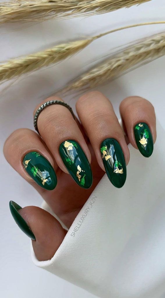 Sophisticated Emerald Green and Gold Nail Design with Glossy and Matte Finishes.