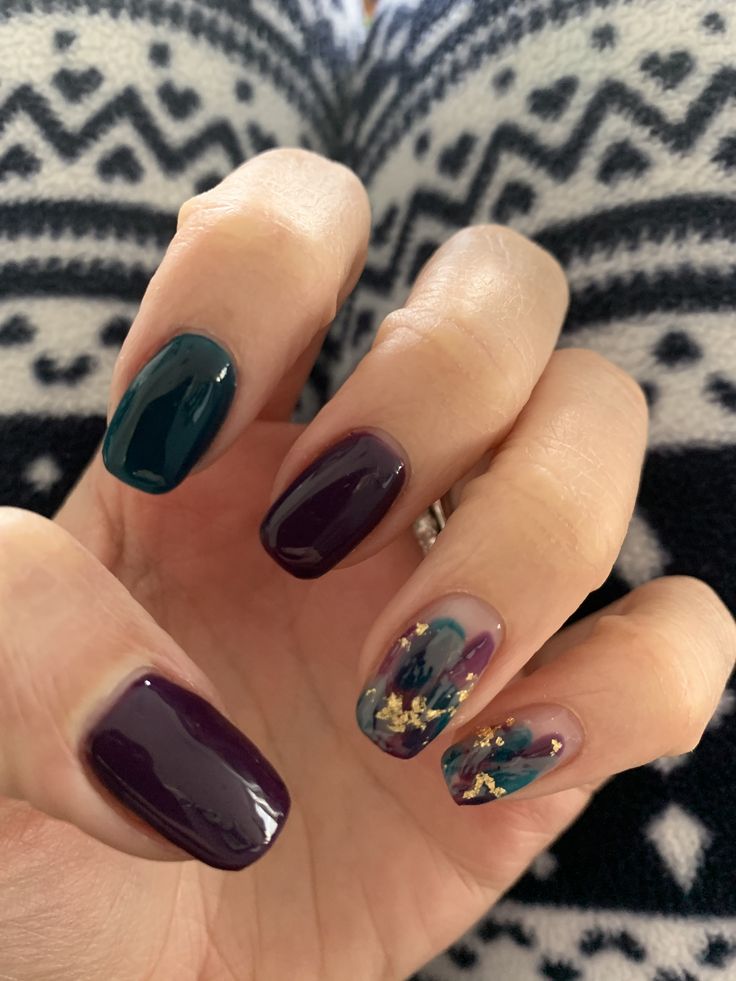 Elegant Nail Design: Deep Emerald and Bold Plum with Artistic Teal, Purple, and Gold Accent.