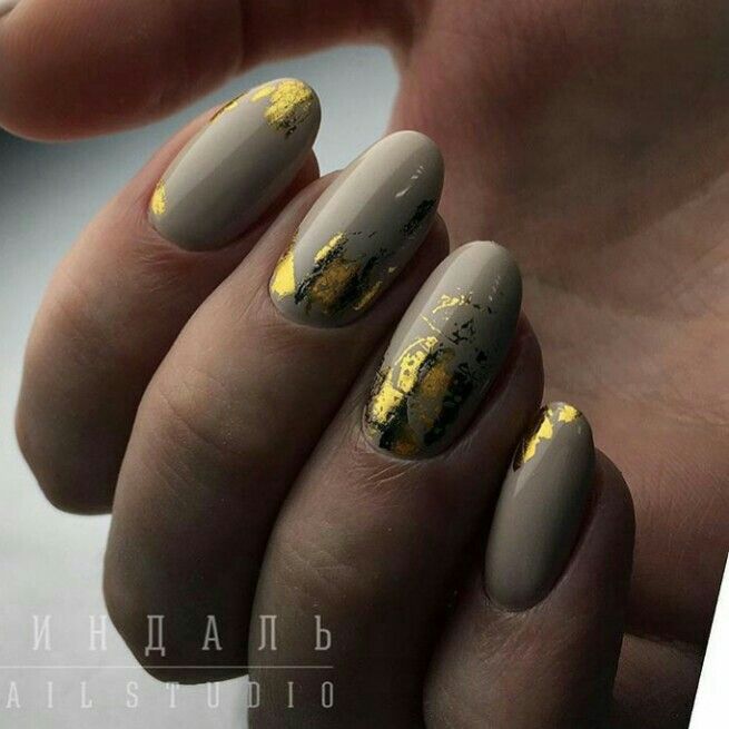 Sophisticated Taupe Nail Design Enhanced with Luxurious Gold Accents.