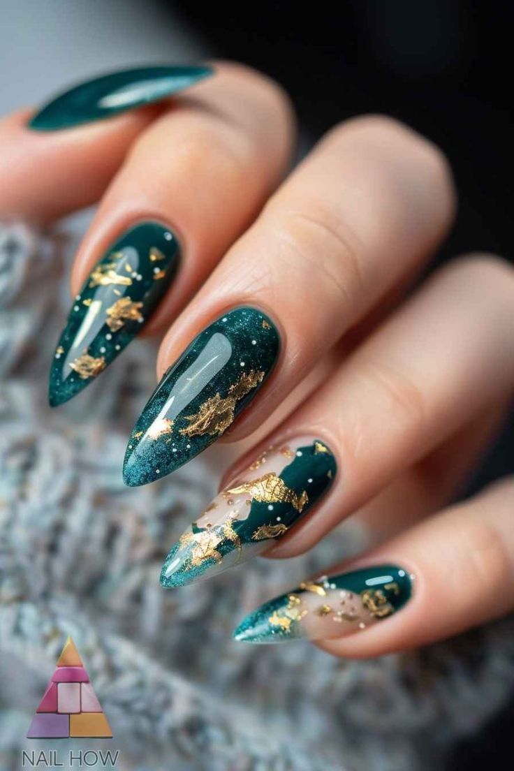 Elegant Emerald Green Nail Design with Intricate Gold Leaf Accents and Sparkling Finish