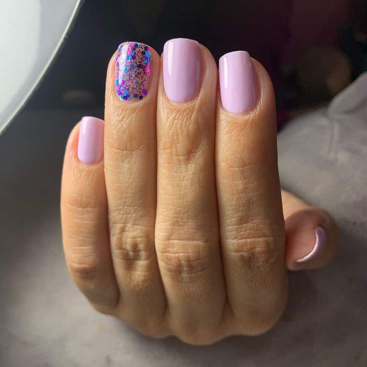 Playful Pastel Lilac Nail Design with Vibrant Glitter Accent