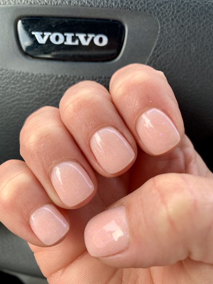 Elegant Natural Nude Nail Design with Subtle Shimmer for a Chic Look.