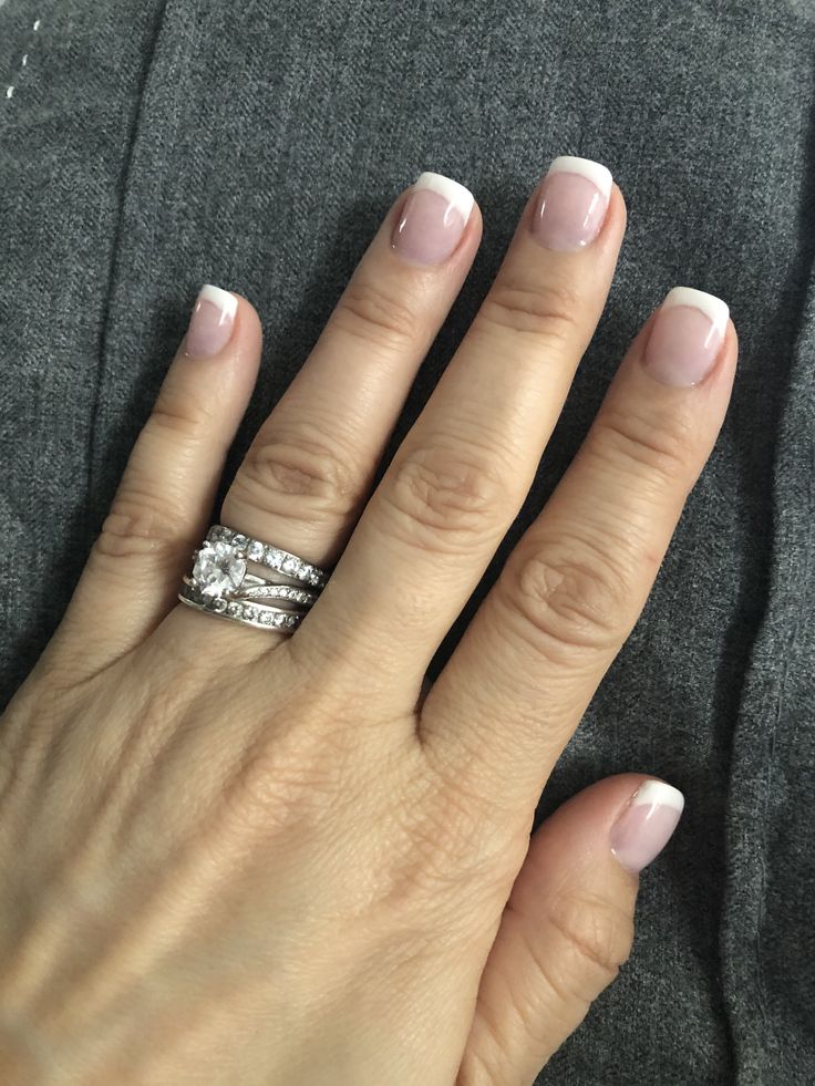 Timelessly Sophisticated French Manicure with Sparkling Accents.