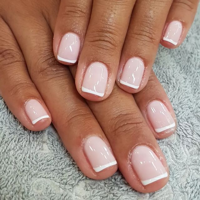 Sophisticated Elegant French Manicure with Soft Pink and Delicate White Tips