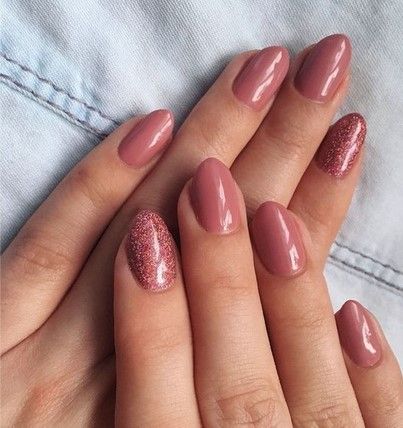 Sophisticated Mauve Nail Design with Glossy Finish and Glitter Accents.