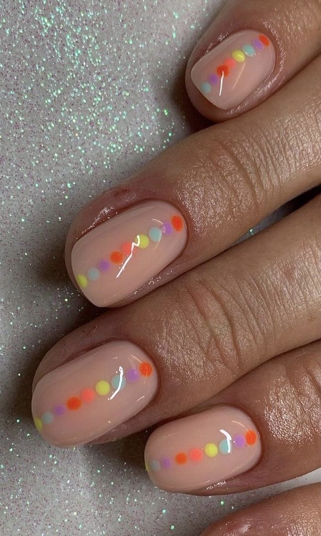 Whimsical Dot Design: Vibrant Dots on Nude Nails for Cheerful Occasions